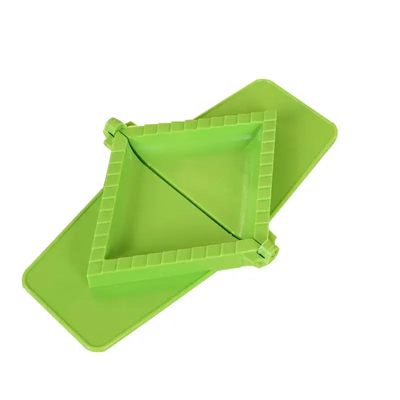 Bright green plastic dumpling maker with triangular mold and ridged edges from triangle green blue and pink dumpling maker set