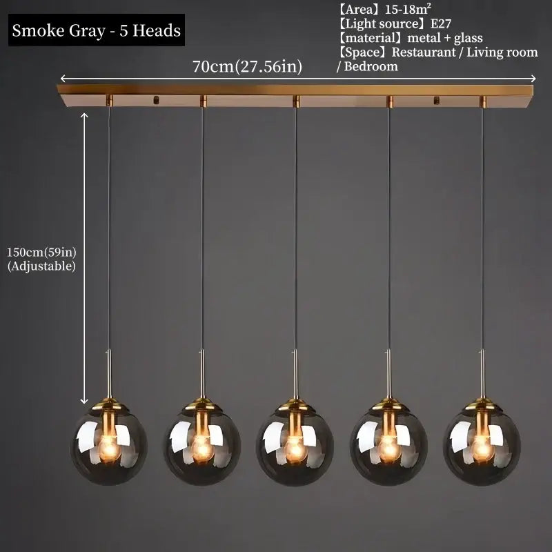 Smoke gray spherical pendant light with five glass globes and brass bar for dining room polished steel fixture