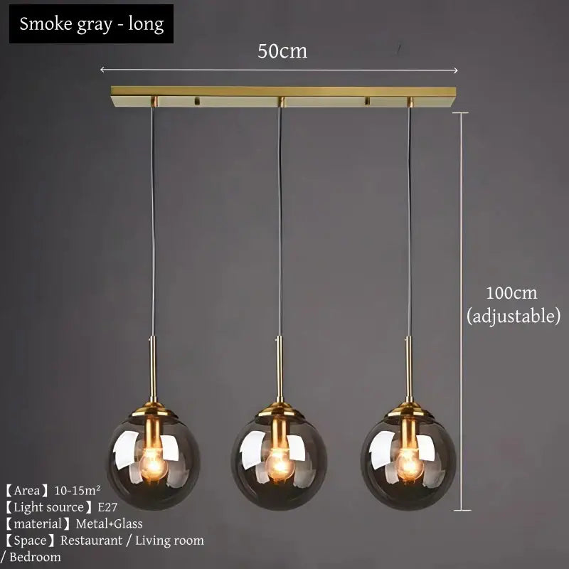 Smoke gray three-light glass pendant light with brass accents and polished steel for dining room lighting