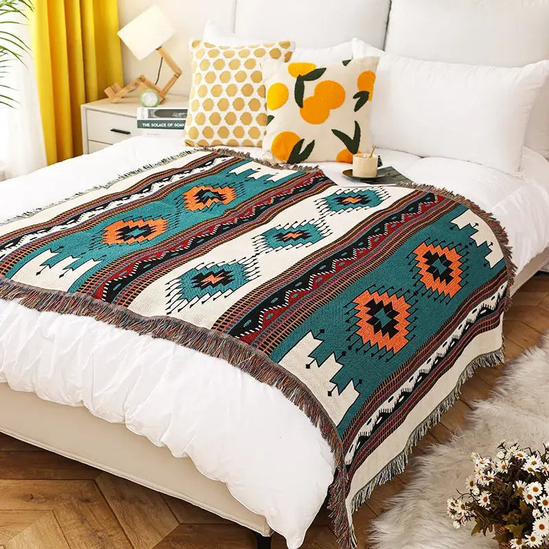 Tropical floral teal and pink cozy knit throw blanket with vibrant geometric pattern and decorative fringe decorbites cozy knit