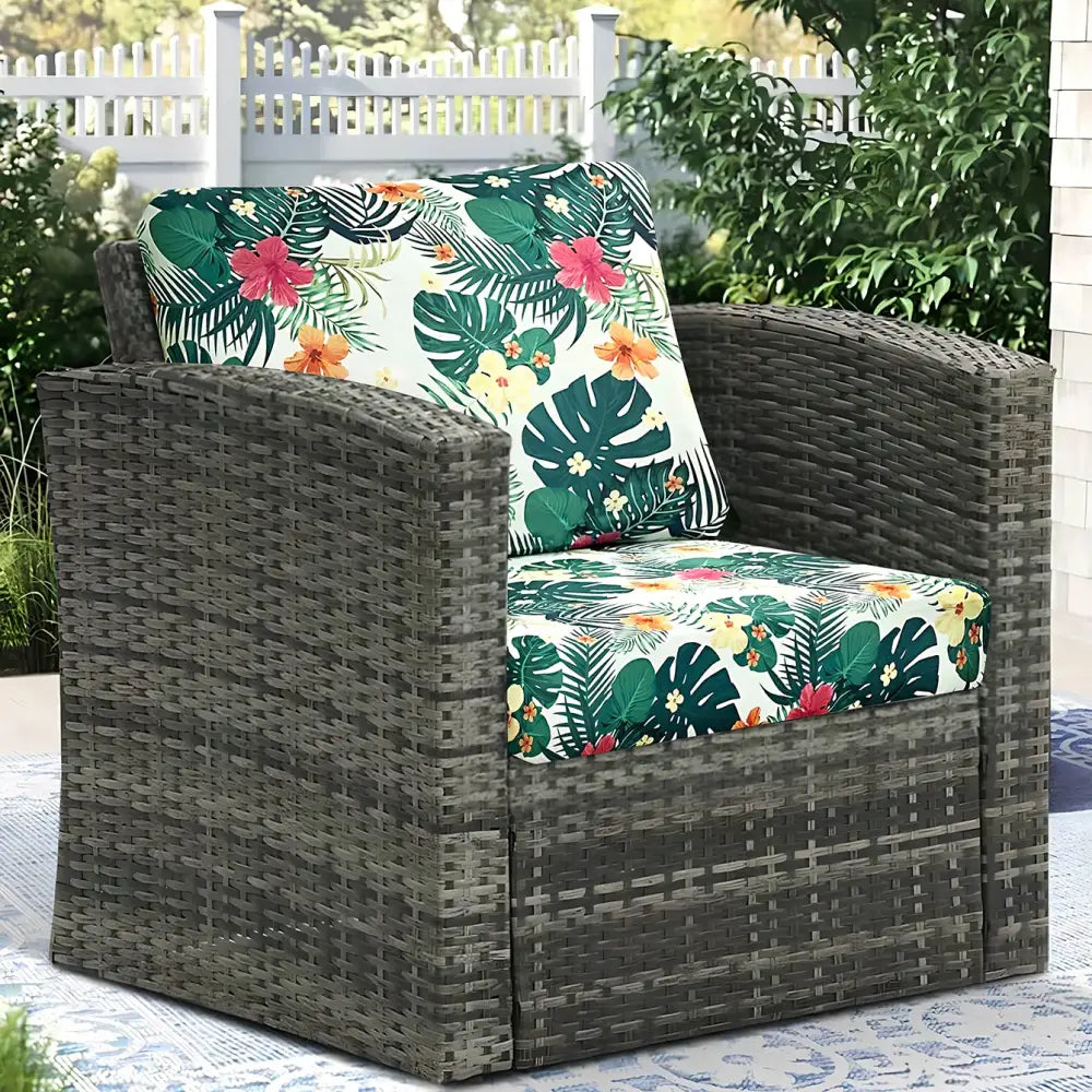Dark gray wicker armchair with vibrant tropical floral cushions in brushed polyester microfiber for outdoor use