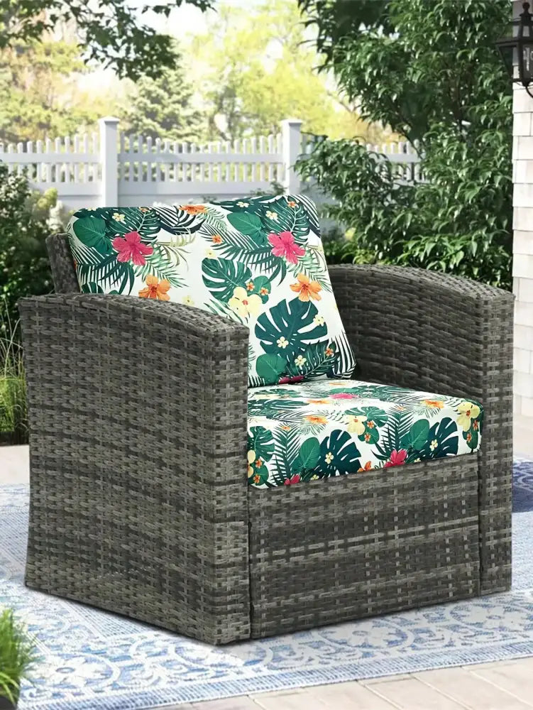 Dark gray woven wicker patio chair with tropical print cushions in brushed polyester microfiber for outdoor use