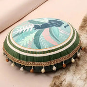Round green ethnic print tassel cushion cover with tropical leaf and black bird design trimmed in gold chain for decorbites living room decor