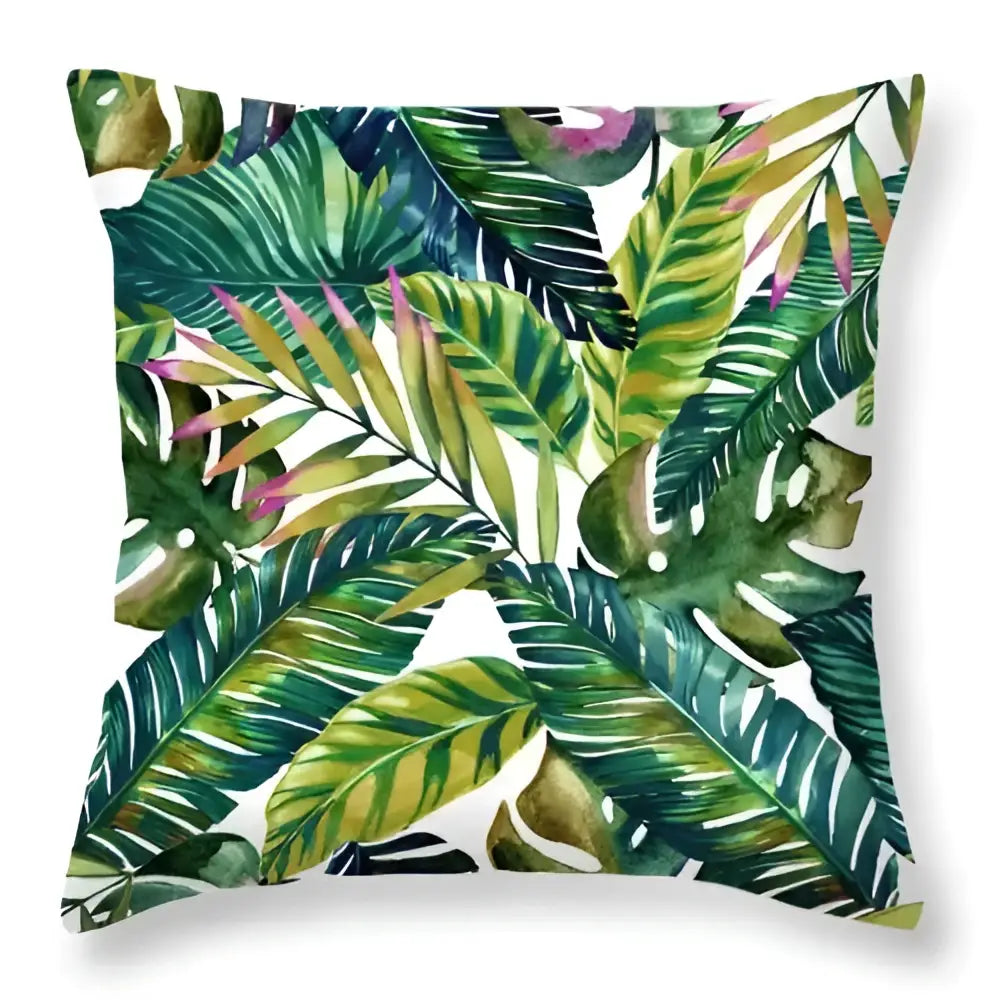 A square throw pillow with vibrant green leaves decorative watercolor print for tropical home decor