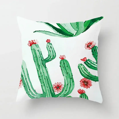 White throw pillow with watercolor green leaves decorative cacti and pink flowers for tropical home decor