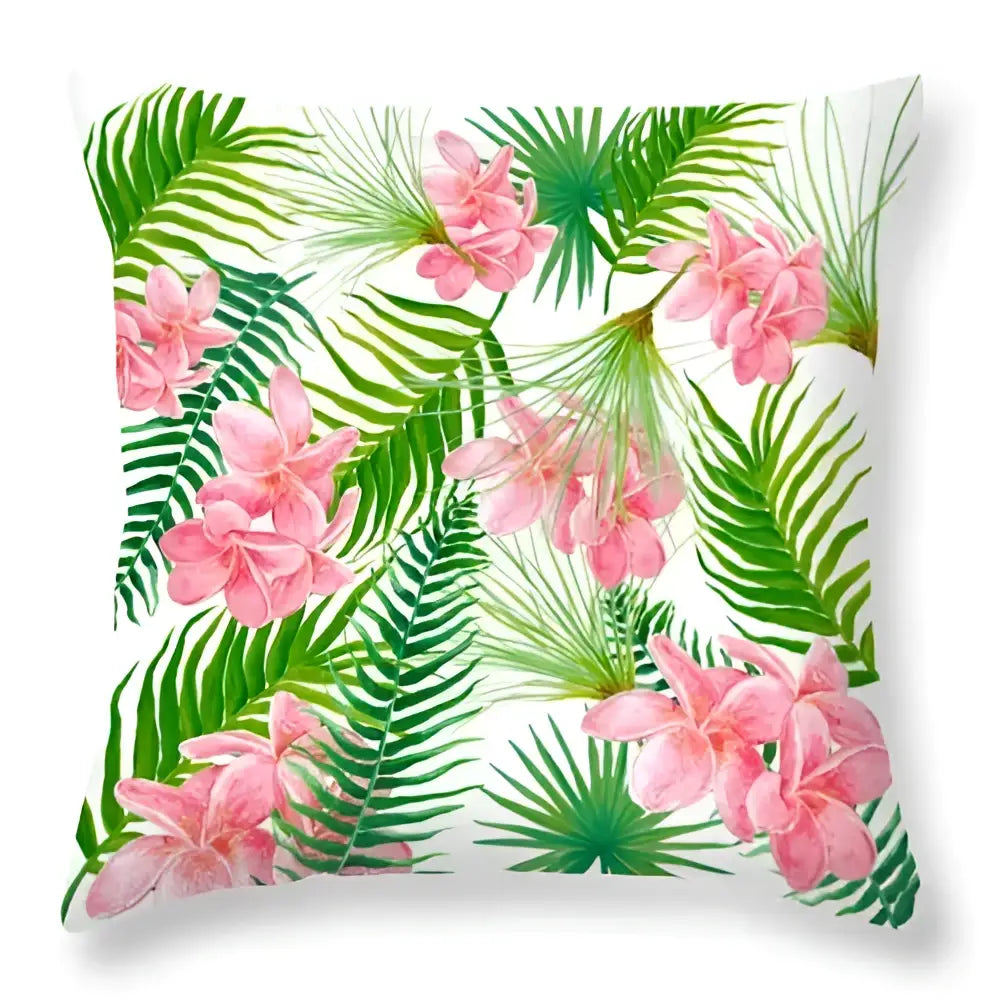 A square throw pillow with vibrant pink plumeria and green leaves decorative design for home decor living room use