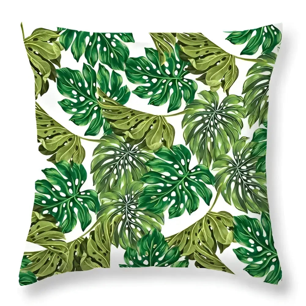 A square throw pillow with vibrant green leaves decorative pattern on white background for living room home decor