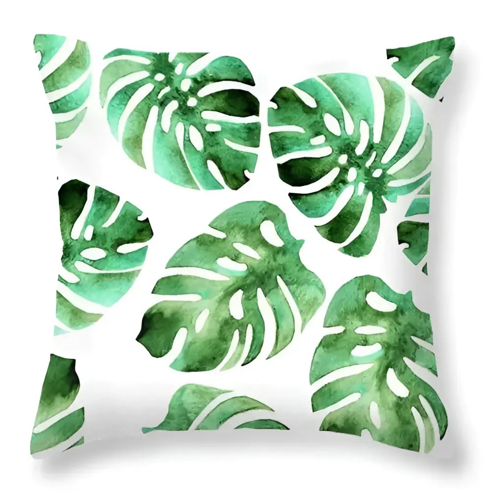 White throw pillow with green leaves decorative watercolor monstera pattern for tropical home decor living room