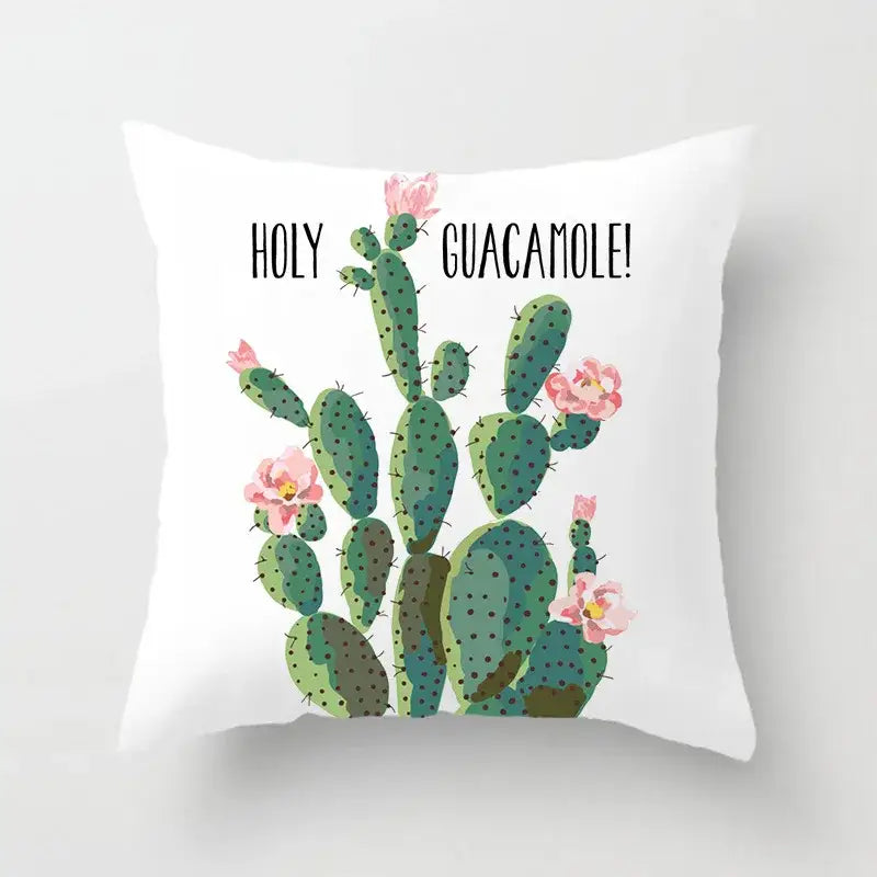White throw pillow with green leaves decorative cactus illustration and holy guacamole text for home decor