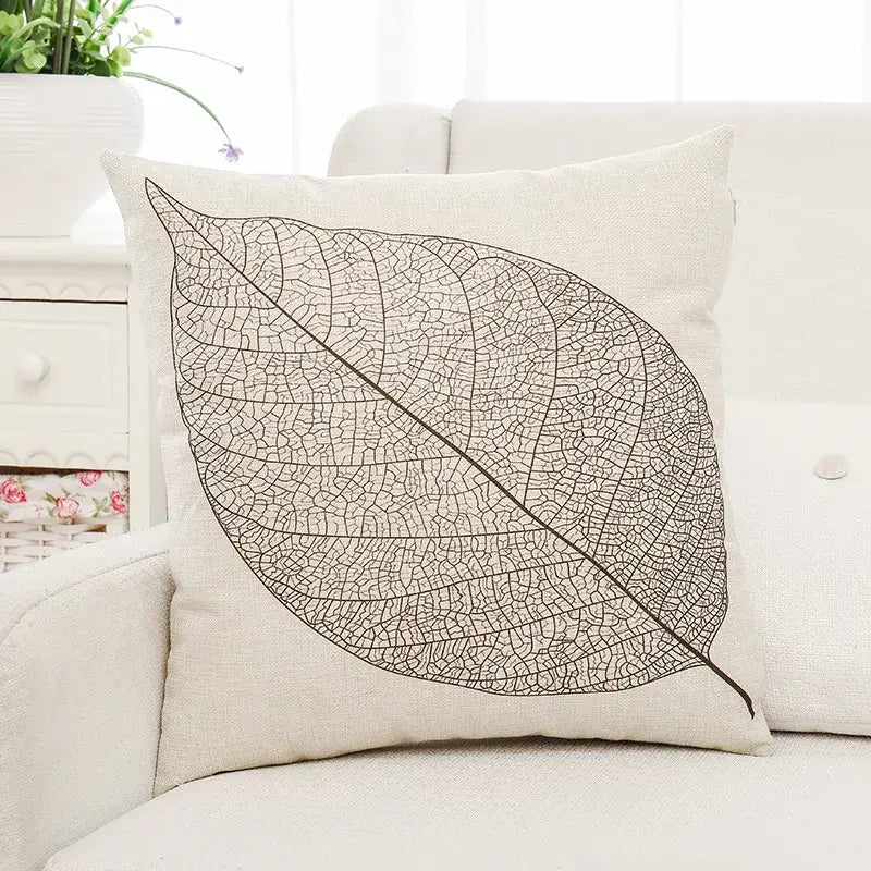 Beige linen cushion cover with detailed black leaf vein pattern featuring decorbites green plant leaves design