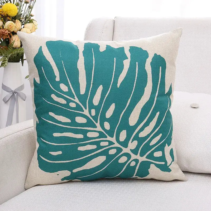Teal monstera leaf patterned linen cushion cover featuring green plant leaves decorbites design for living room decor