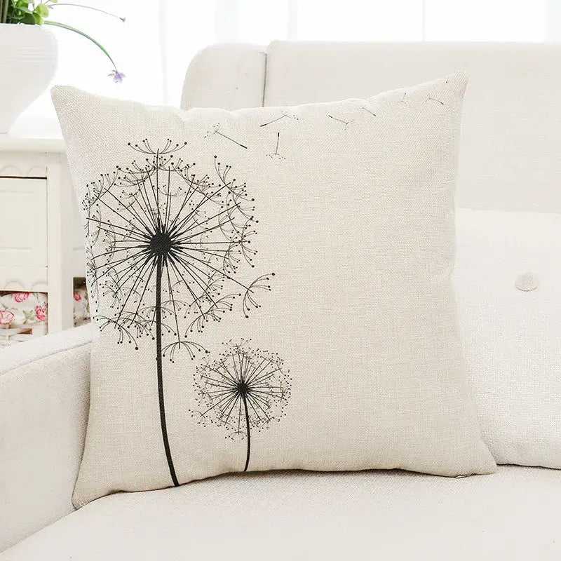 Beige linen cushion cover with black ink-style dandelion and decorbites green plant leaves for living room decor