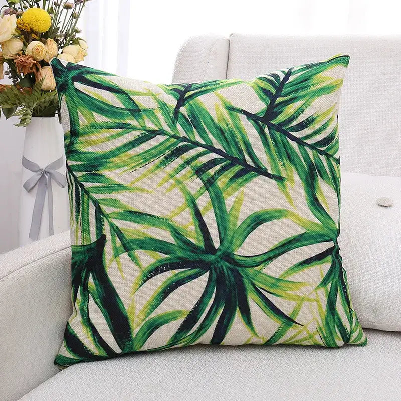 Square cushion cover with vibrant green plant leaves pattern on off-white linen fabric for living room decorbites decor