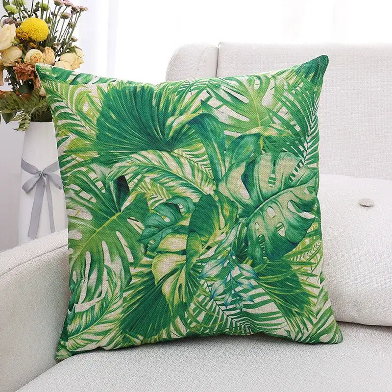 Green tropical leaf patterned linen cushion cover featuring decorbites green plant leaves for living room decor