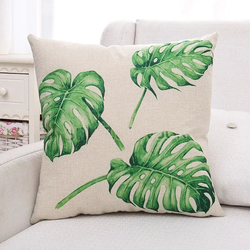 Beige linen cushion cover with vibrant green plant leaves pattern perfect for tropical living room decorbites decor