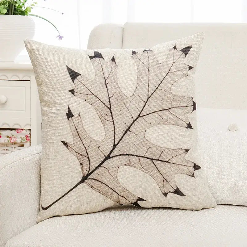Beige linen cushion cover featuring detailed black and gray leaf design for decorbites green plant living room decorbites green plant leaves