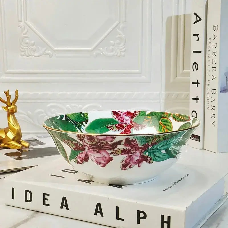 White ceramic bowl from the green leaf collection with pink orchids green leaves and a gold rim for porcelain tea set