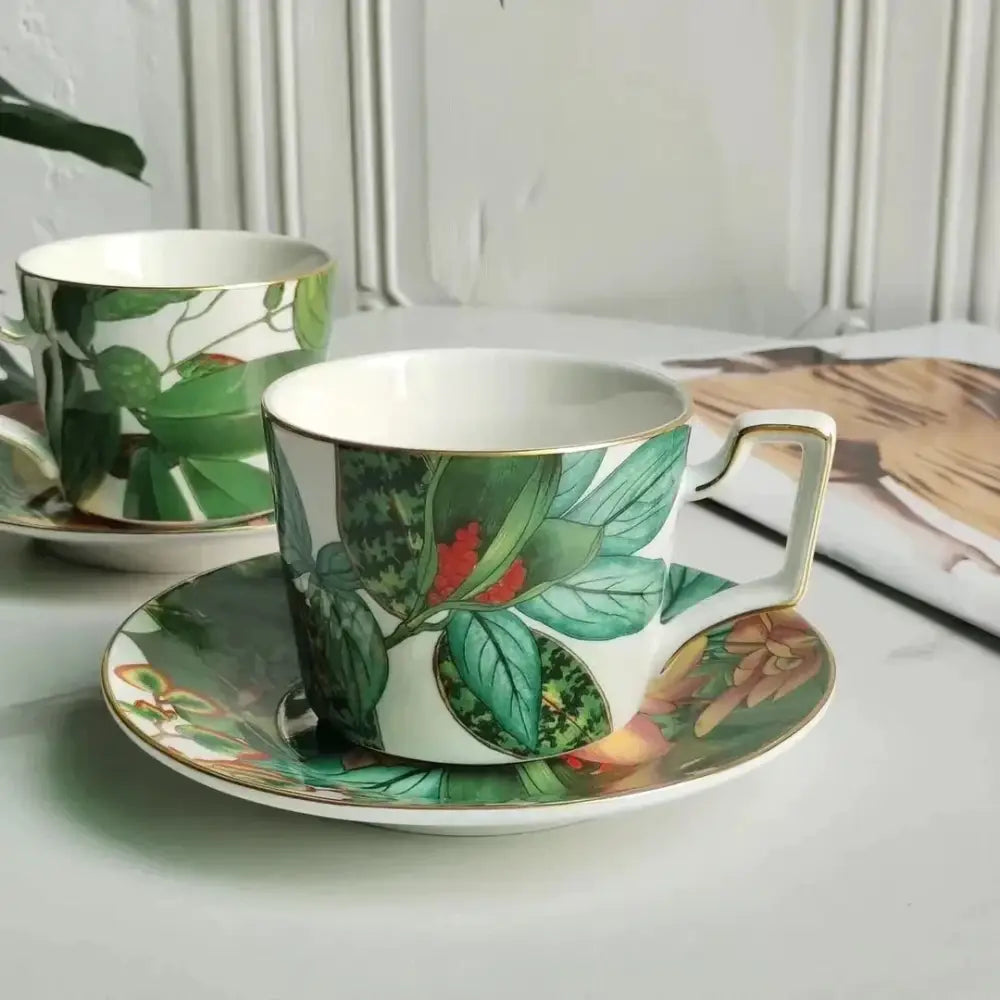 White porcelain teacup and saucer from tropical green leaf collection with vibrant leaves and flowers for enhanced dining experience