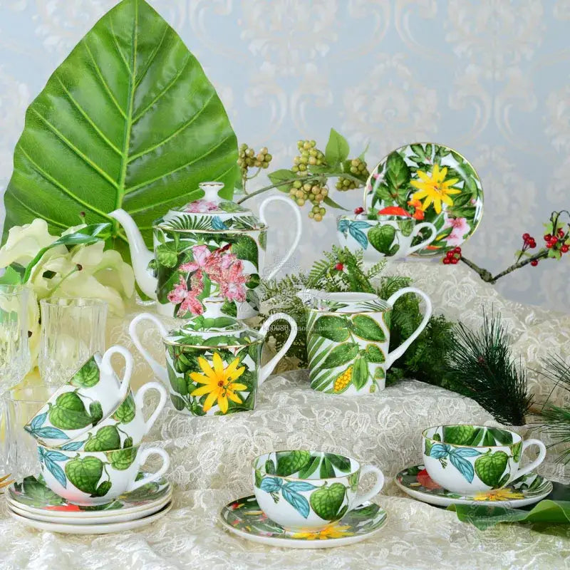 White ceramic teapot from green leaf collection with vibrant tropical floral design featuring pink orchids and sunflowers