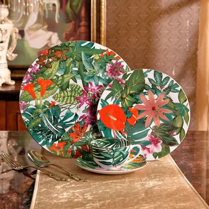 Vibrant tropical green leaf collection porcelain tea set with bold green orange and pink floral patterns on glossy white porcelain
