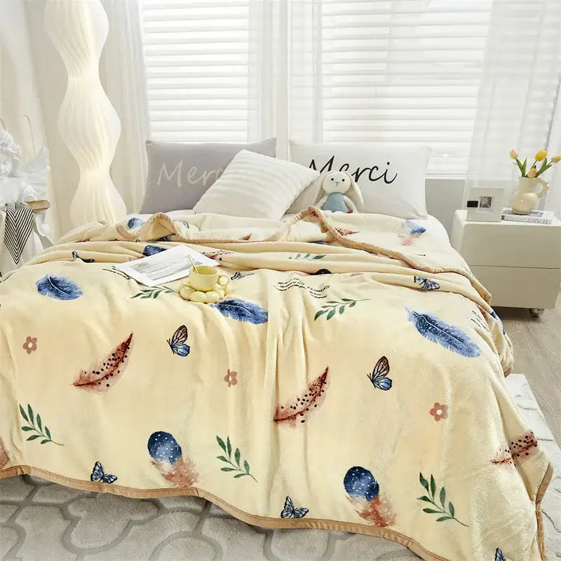 Cream-colored decorbites cozy flannel blanket with blue and brown feathers and butterflies, soft tropical leaf throw