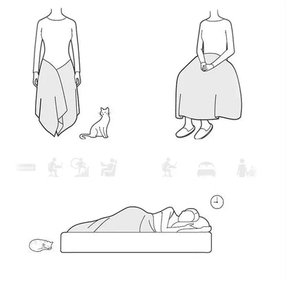 Gray illustrated dress with draped asymmetrical hemline and long sleeves paired with decorbites cozy flannel blanket