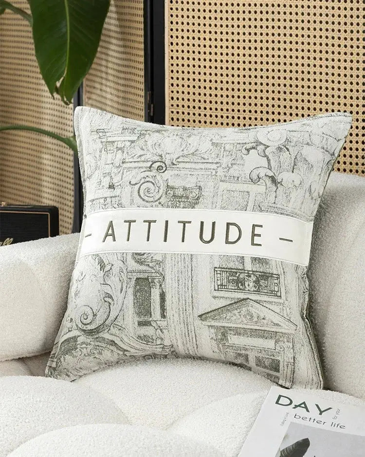 Off-white embroidered patchwork cushion cover with black and white architectural sketch and attitude banner for living room