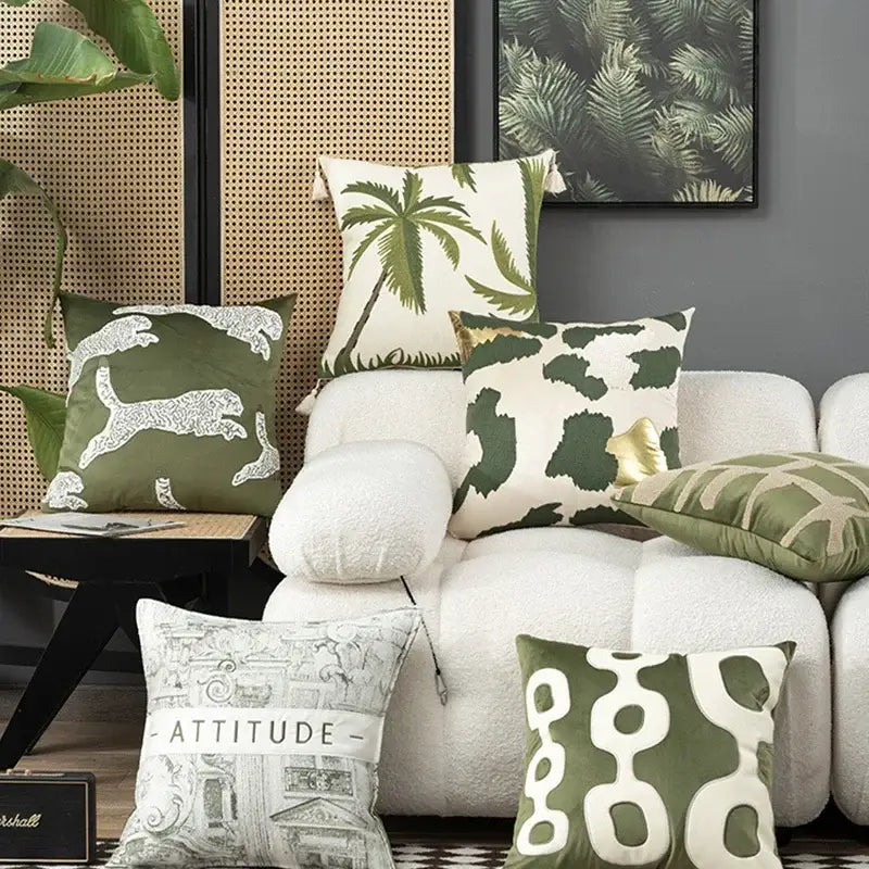 Olive green and cream tropical embroidered patchwork cushion cover featuring animal and abstract designs for living room