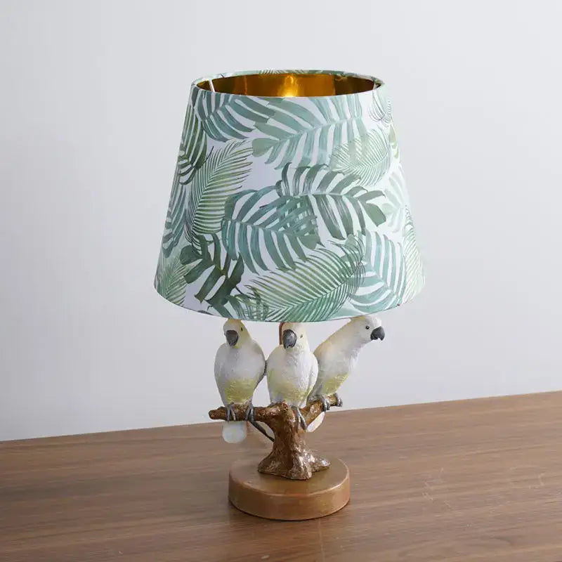 Decorbites cartoon parrot desk lamp with white bird base and green tropical leaf shade for children room decor