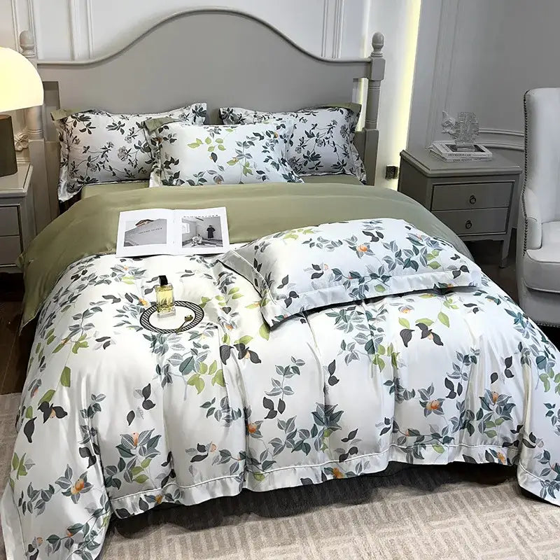 White duvet cover with green and gray botanical print and ruffled edges in tropical sage green printed faux silk bedding set