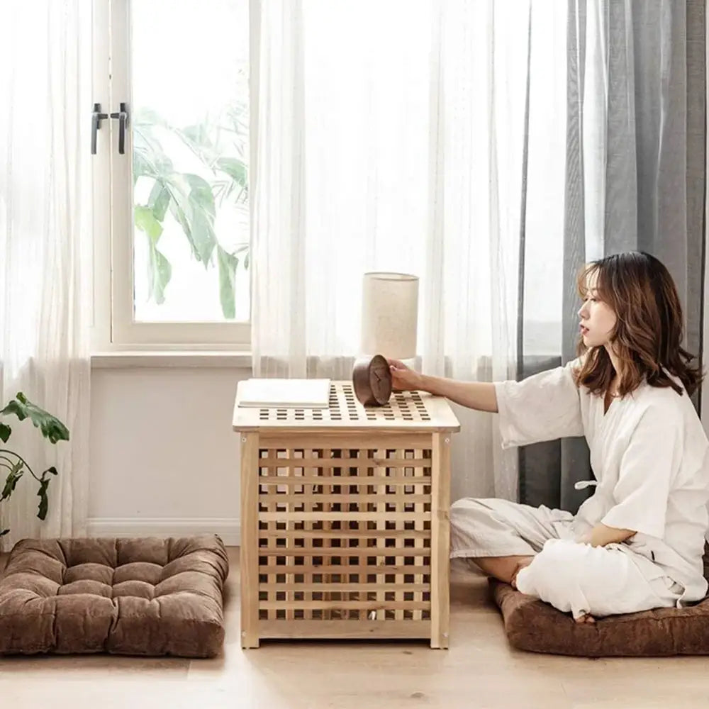 Light-colored wooden lattice storage box with flat top complements decorbites corduroy floor seat cushion pouf