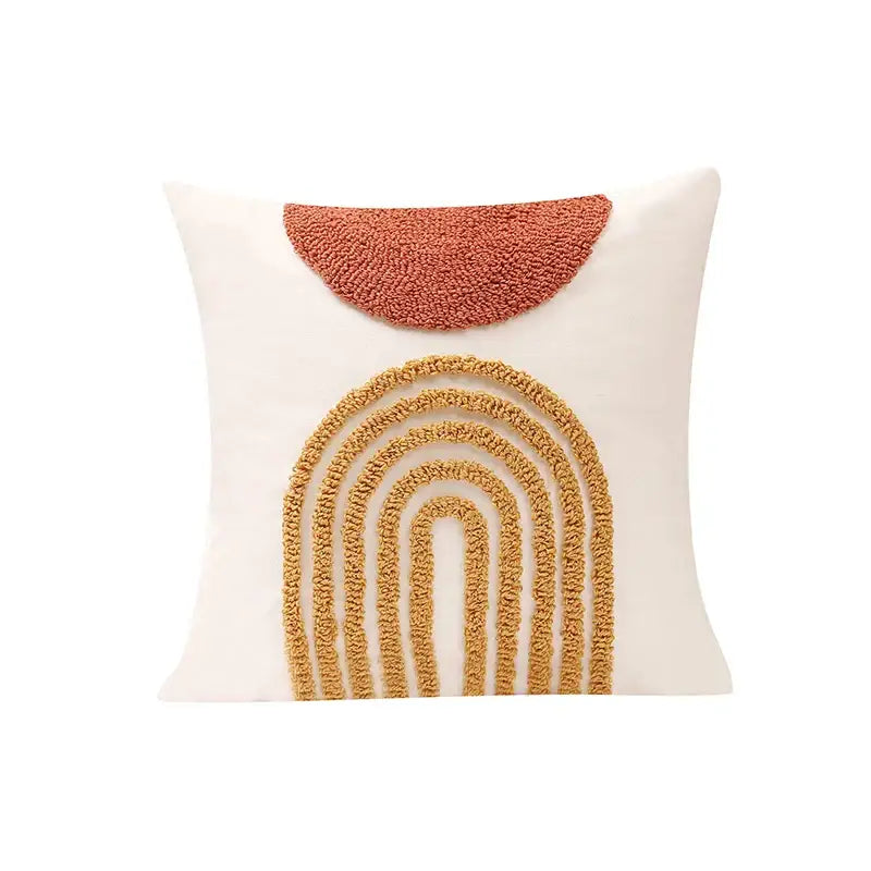 Cream-colored cushion cover with textured burnt orange terracotta half-circle and mustard yellow geometric tufted design