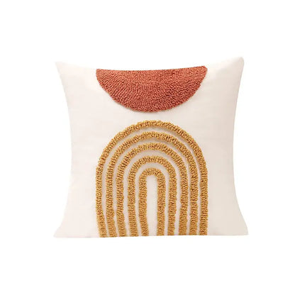 Cream-colored cushion cover with textured terracotta half-circle and layered mustard-yellow arch decorbites gematric tufted design