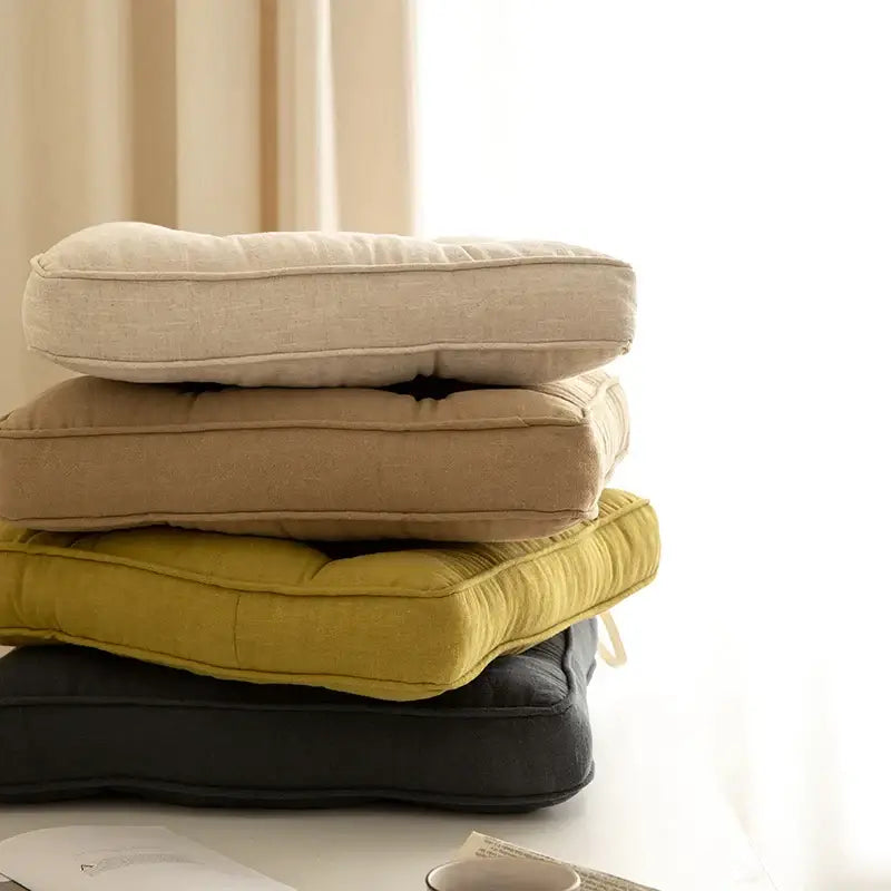 Stacked square tufted button cushions in beige tan mustard yellow and dark gray for living room decorbites button cushion