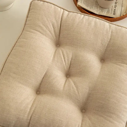 Beige linen tufted button cushion with soft textured surface and subtle button detailing for living room decorbites button cushion