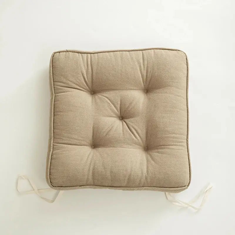 Beige linen decorbites button cushion with tufted square design and matching ties for living room decor