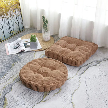 Two tan corduroy seat cushions with tufted floor design featuring round and square decorbites corduroy tufted pads