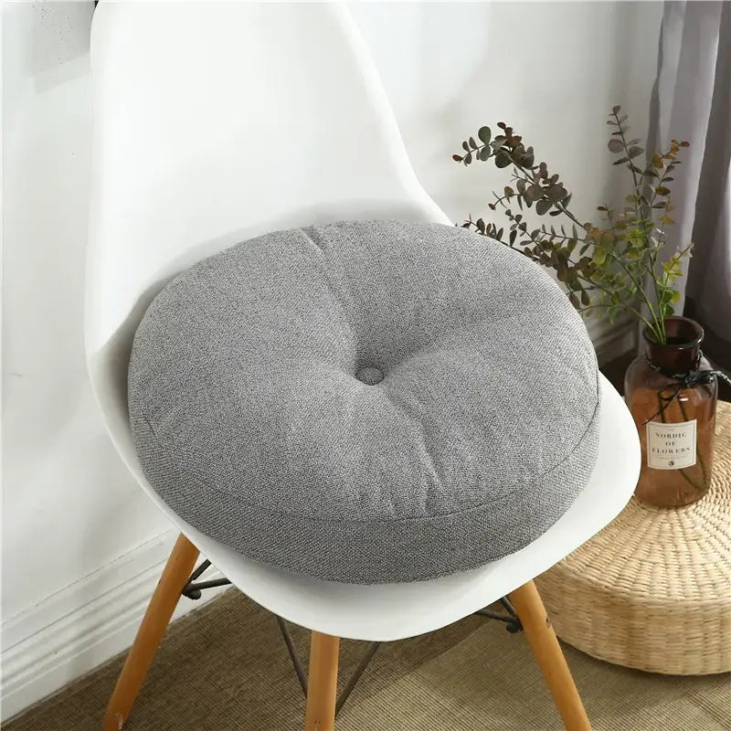 Gray tufted linen floor pillow seating cushion with textured fabric for living room pillow seating cushion