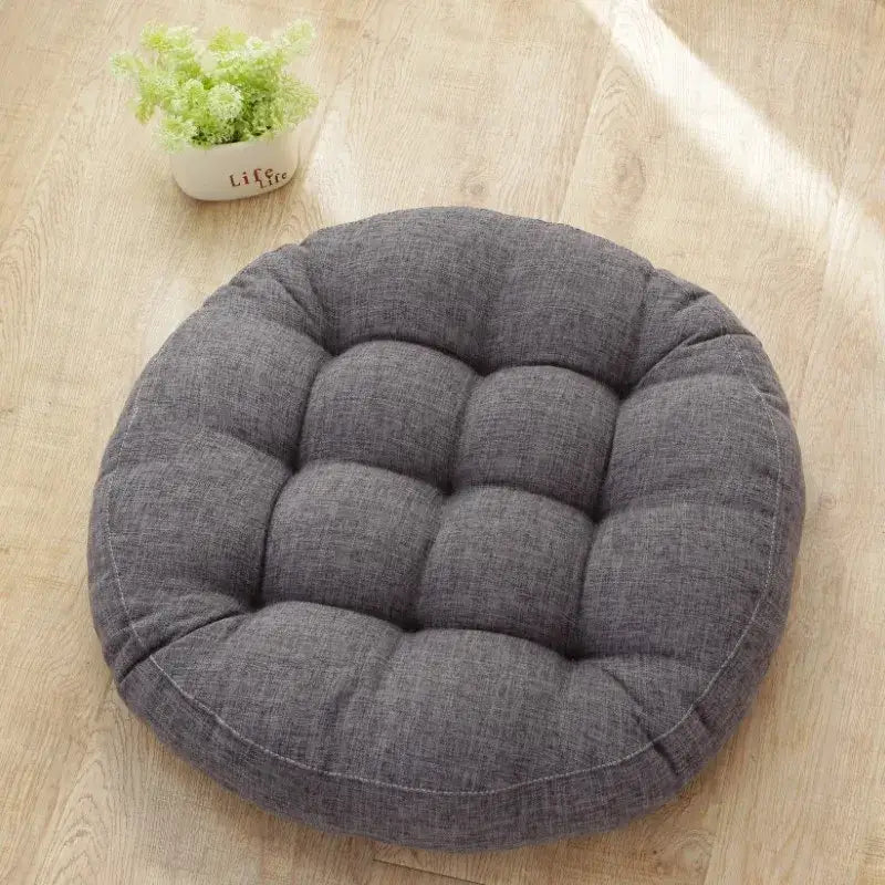 Gray tufted fabric kids round floor cushion with plush circular design for bedroom seating decorbites kids round