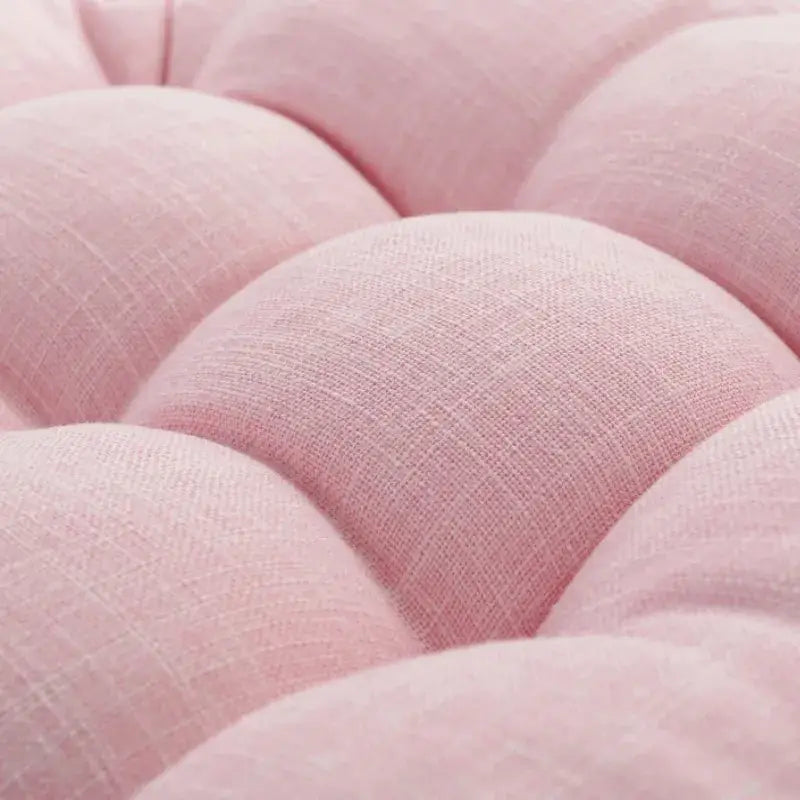 Soft pink tufted fabric with a subtle woven texture on decorbites kids round floor cushions for bedroom seating