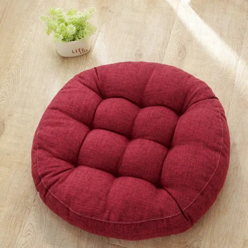 Red round kids round floor cushion with quilted textured fabric for bedroom seating by decorbites