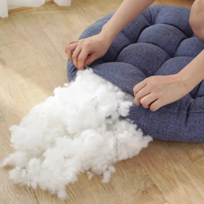 Blue quilted fabric kids round floor cushion with white fluffy stuffing beside for bedroom seating decorbites kids round