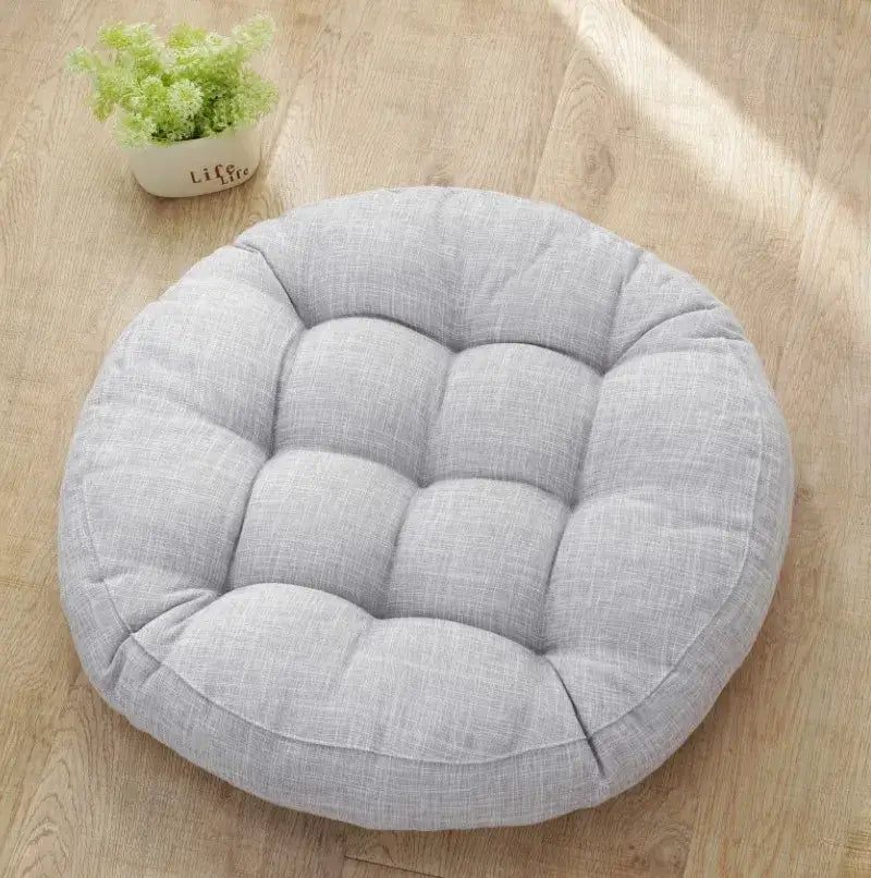 Light gray tufted kids round floor cushion with soft linen fabric and circular design for bedroom seating decorbites kids round