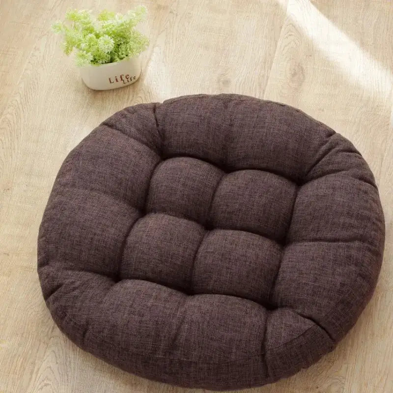 Brown tufted kids round floor cushion with textured fabric surface for bedroom seating by decorbites kids round