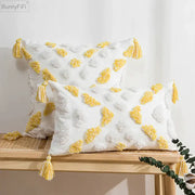 White and yellow cushion cover with tufted tassels and textured soft fabric for decorbites boho style living room decor