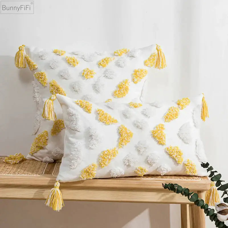White and yellow cushion cover with tufted tassels and textured soft fabric for decorbites boho style living room decor