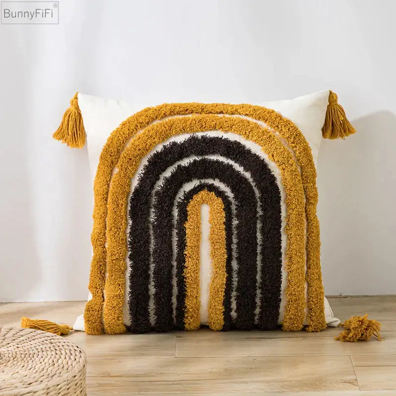 Cozy mustard-yellow and black rainbow-patterned cushion cover with tufted tassels by decorbites boho style for living room decor