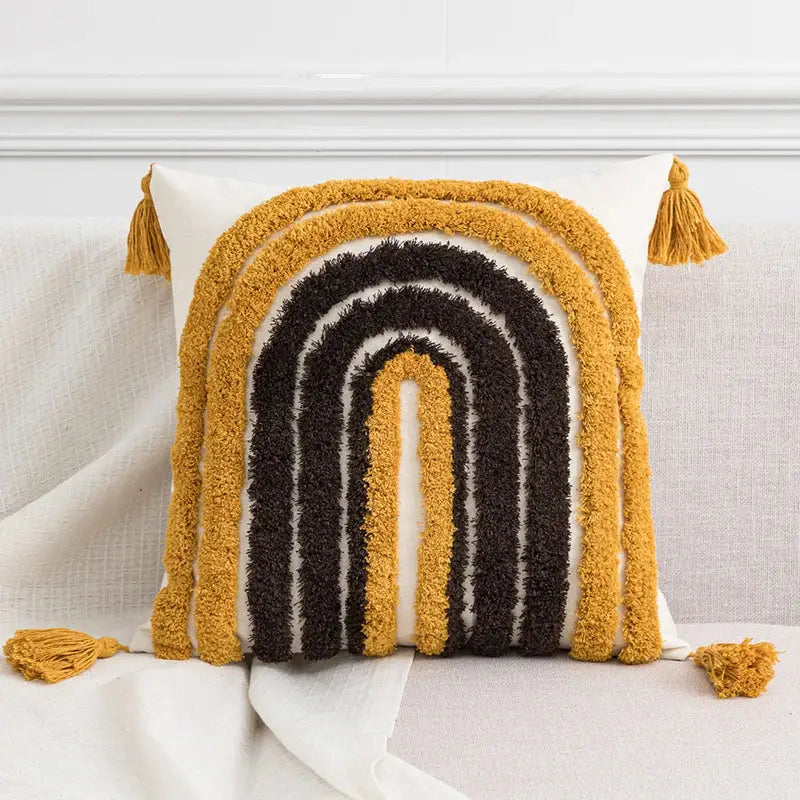Cozy white cushion cover with textured hand-tufted rainbow design mustard yellow black tufted tassels decorbites boho style