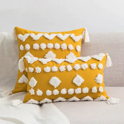Vibrant mustard-yellow cushion cover with tufted tassels and textured pom-poms for decorbites boho style decor