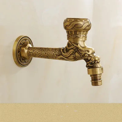 Golden brass washing machine faucet with intricate dragon head carving and ornate antique detailing for outdoor use